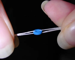 Threading floss through spacer